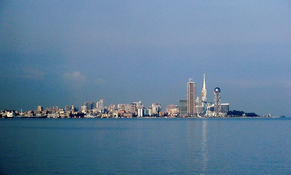 Batumi skyline beside the Black Sea; location imagery, not Kavra Heights