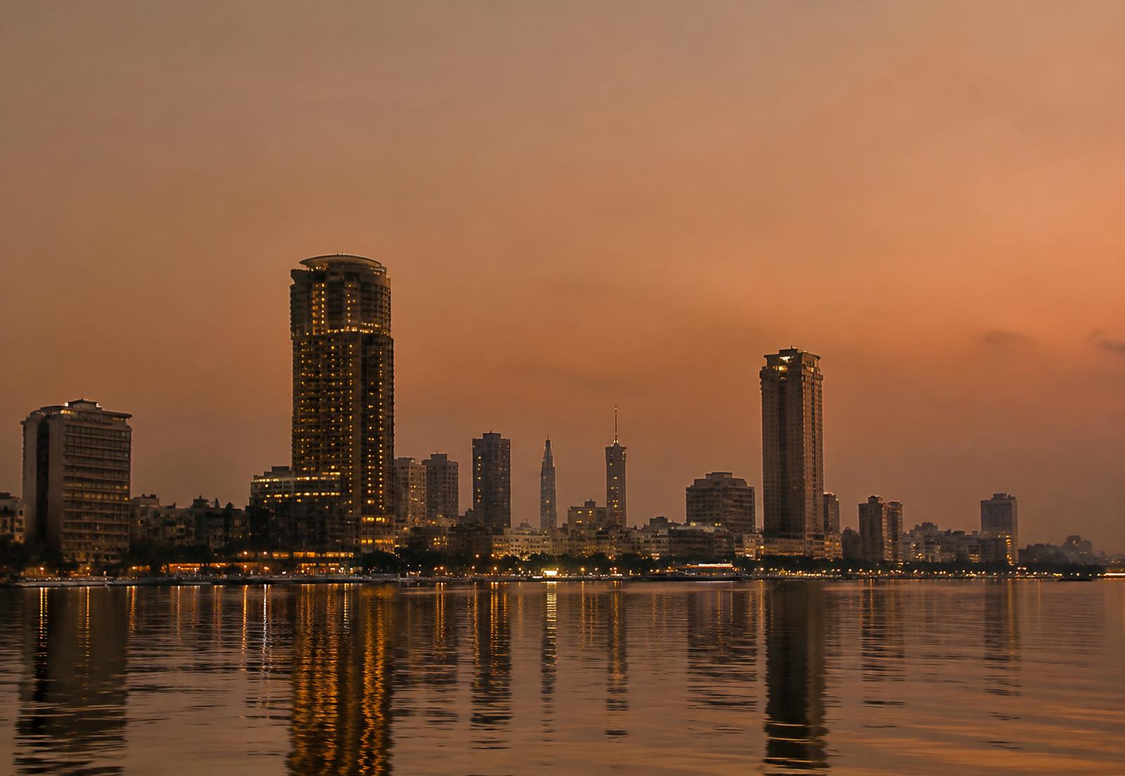 Cairo skyline at dusk reflected in the Nile, near the ROIBUFF regional branch